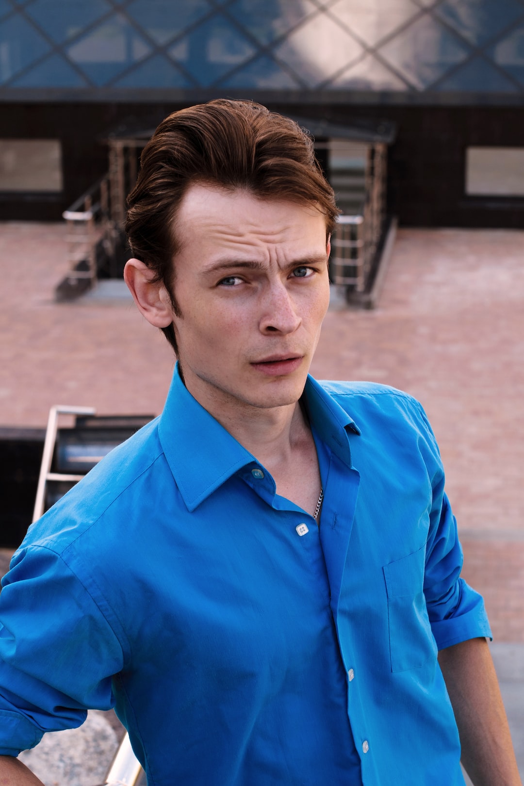 man in blue dress shirt at daytime