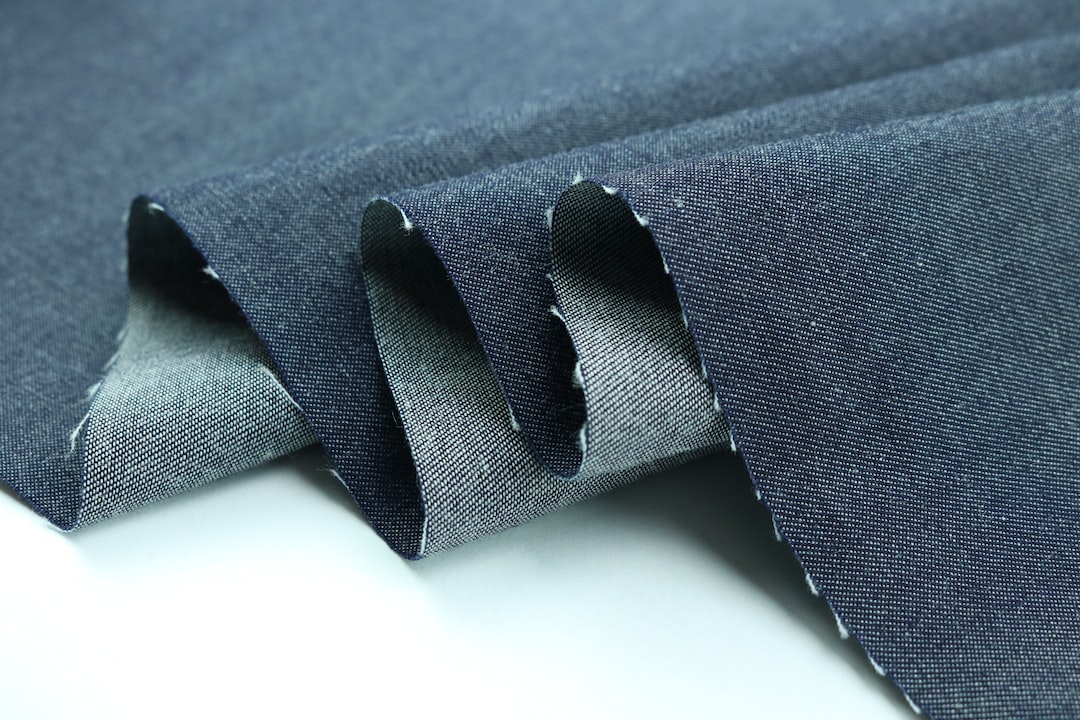 black strap on blue textile