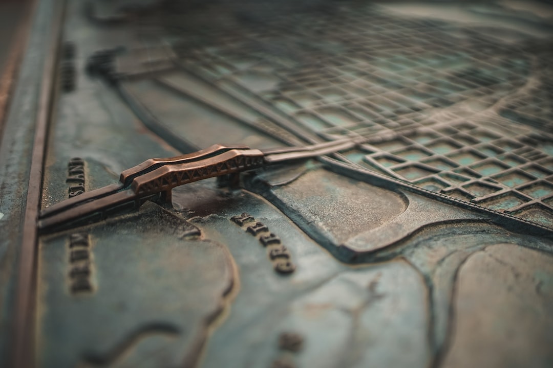 a close up of a metal object with a map in the background