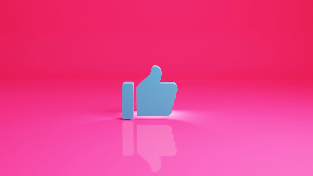 a thumbs up sign on a pink background